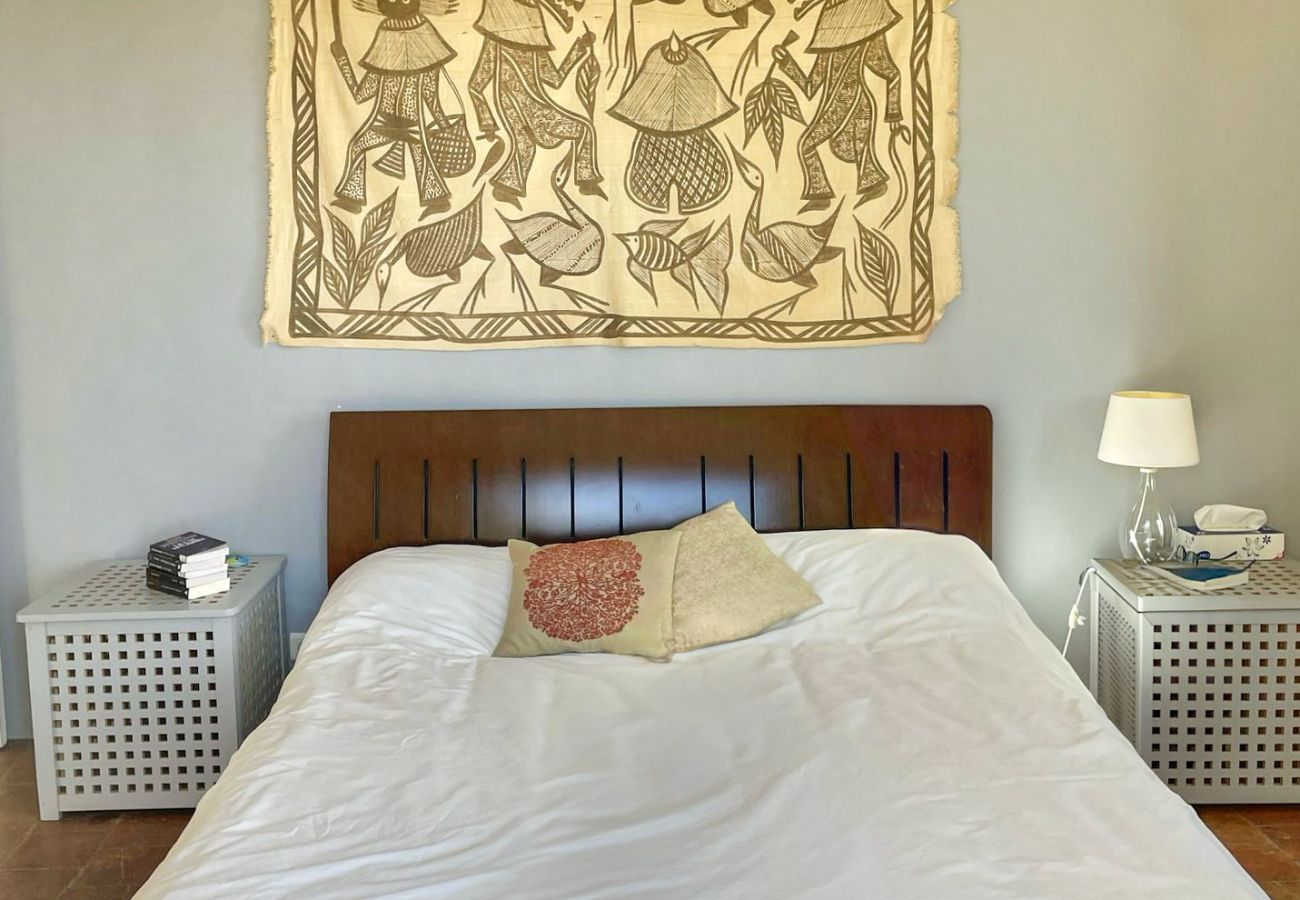 A soothing room with an artistic touch and plenty of sunshine