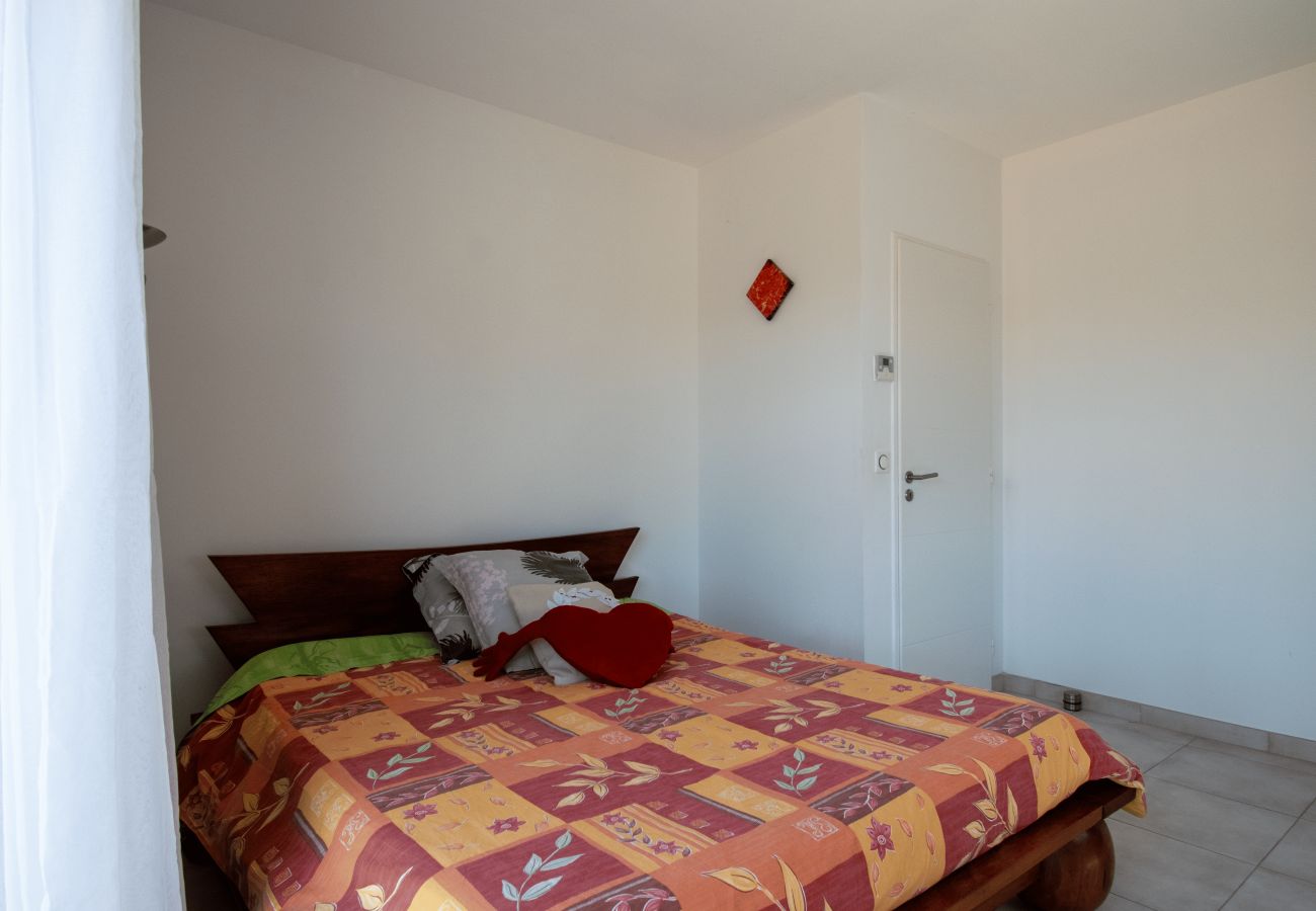 Bright double bedroom with double bed and simple decoration.